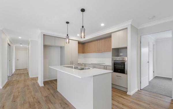 A Kitchen with A Large Island in The Middle of The Room | Mid-North Coast, NSW | BDM Constructions