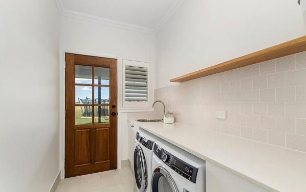 A Laundry Room with A Washer and Dryer and A Sink | Mid-North Coast, NSW | BDM Constructions