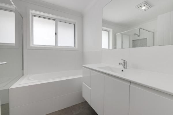 A Bathroom with A Sink, Tub, Mirror and Window | Mid-North Coast, NSW | BDM Constructions