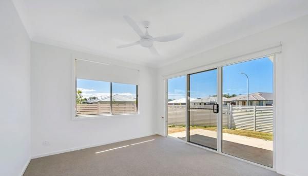 An Empty Room With A Ceiling Fan and Sliding Glass Doors | Mid-North Coast, NSW | BDM Constructions