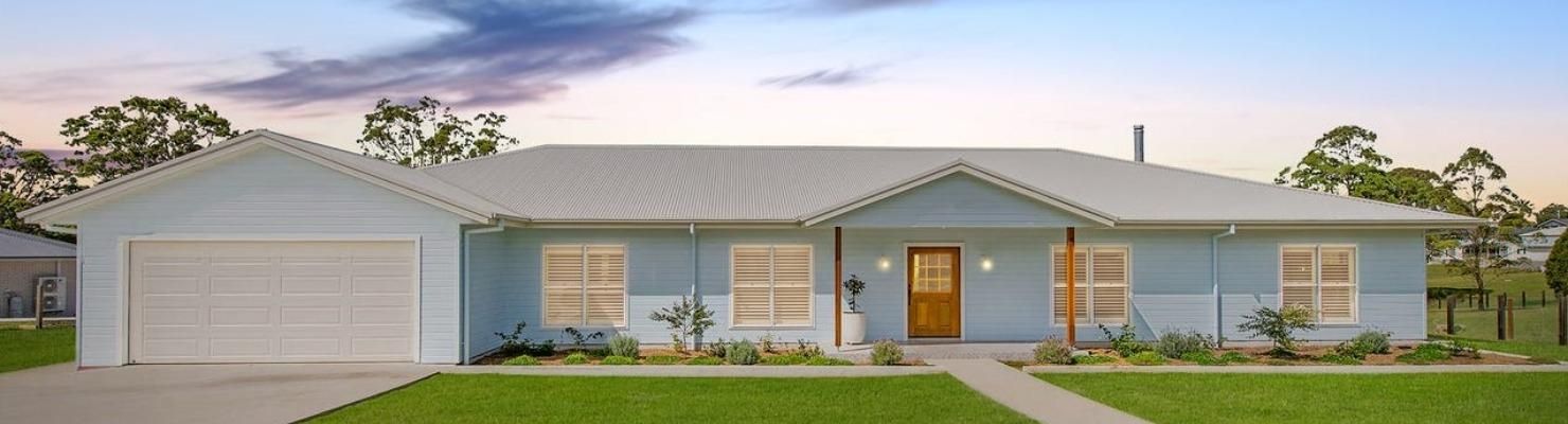 A Blue House with A White Roof and A White Garage Door | Mid-North Coast, NSW | BDM Constructions