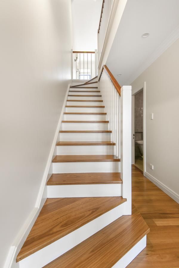 A Staircase with Wooden Steps and White Railing | Mid-North Coast, NSW | BDM Constructions