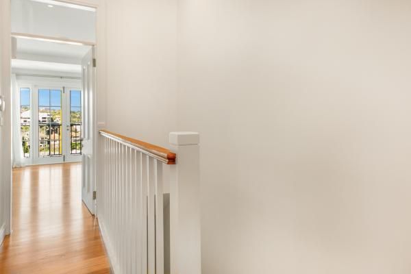 A Hallway with A Railing and A Balcony in A House | Mid-North Coast, NSW | BDM Constructions