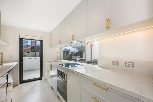 A Kitchen with White Cabinets | Mid-North Coast, NSW | BDM Constructions