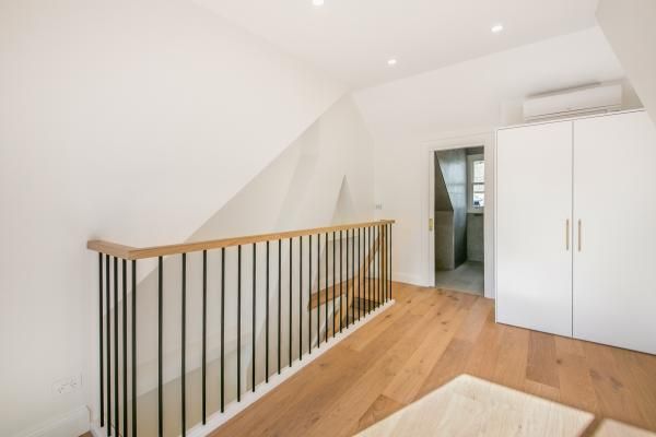 A Staircase with A Wooden Railing in A House | Mid-North Coast, NSW | BDM Constructions
