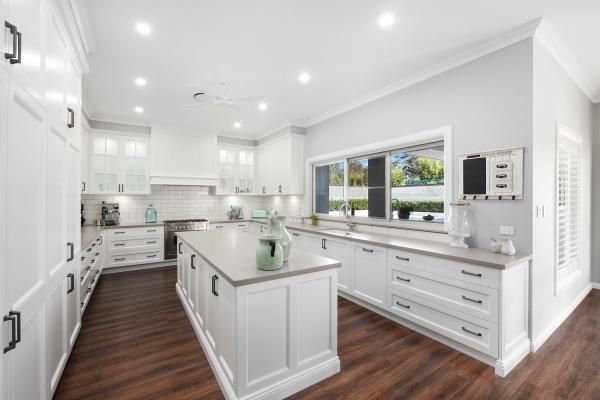 A Kitchen with White Cabinets and A Large Island in The Middle | Mid-North Coast, NSW | BDM Constructions
