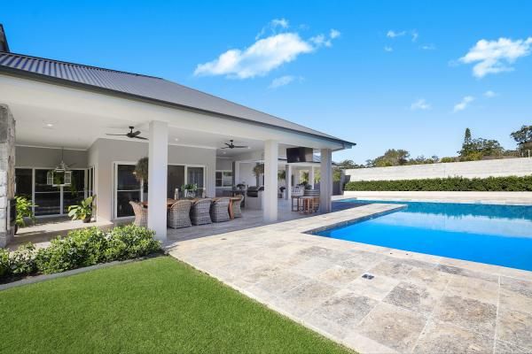 There Is a Large Swimming Pool in The Backyard of A House | Mid-North Coast, NSW | BDM Constructions