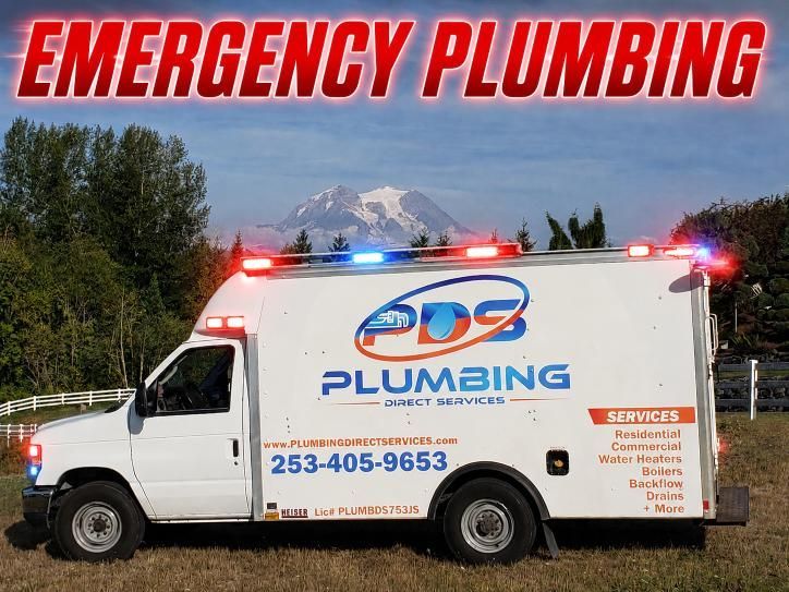 White emergency plumbing truck with flashing lights and “EMERGENCY PLUMBING” text, parked outdoors.