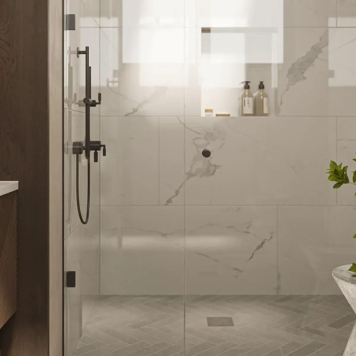 Modern bathroom with glass shower, marble tile, rain showerhead, and frosted window light