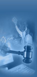 A gavel on a desk, blurred figures in the background. The scene is blue-toned, possibly a courtroom setting.