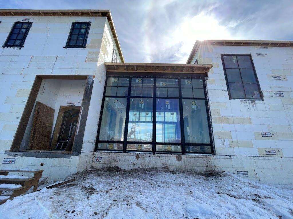 a large building with a lot of windows installed by Sun Glass 