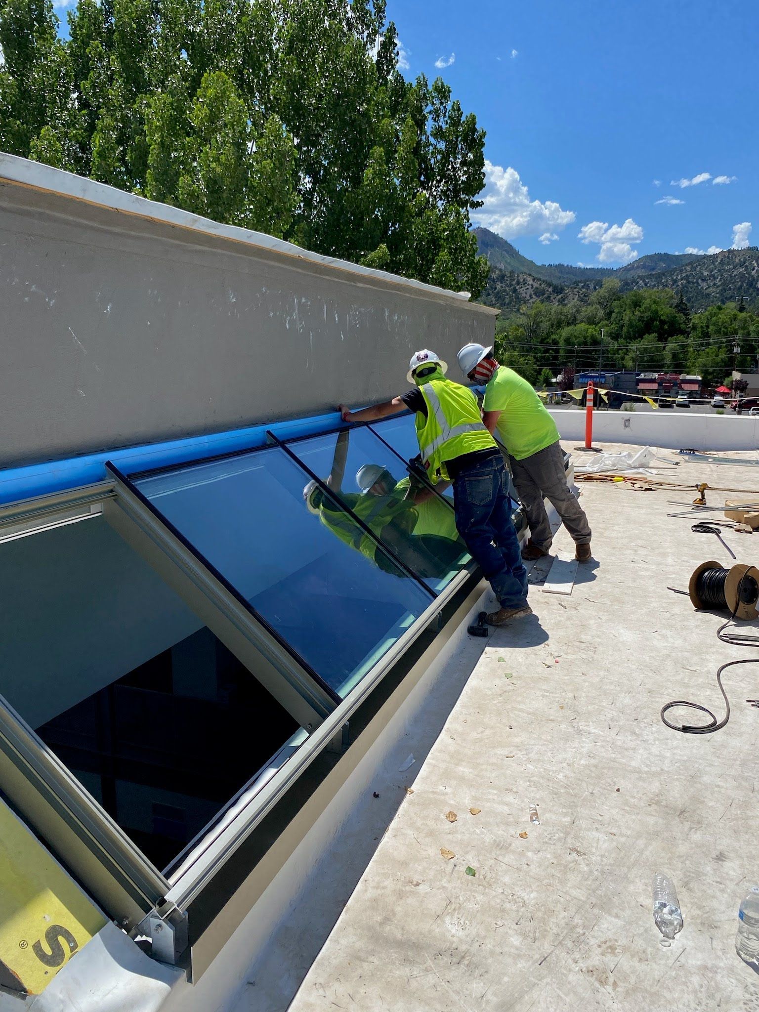 a bathroom with a walk in shower and shower glass installed by Sun Glass