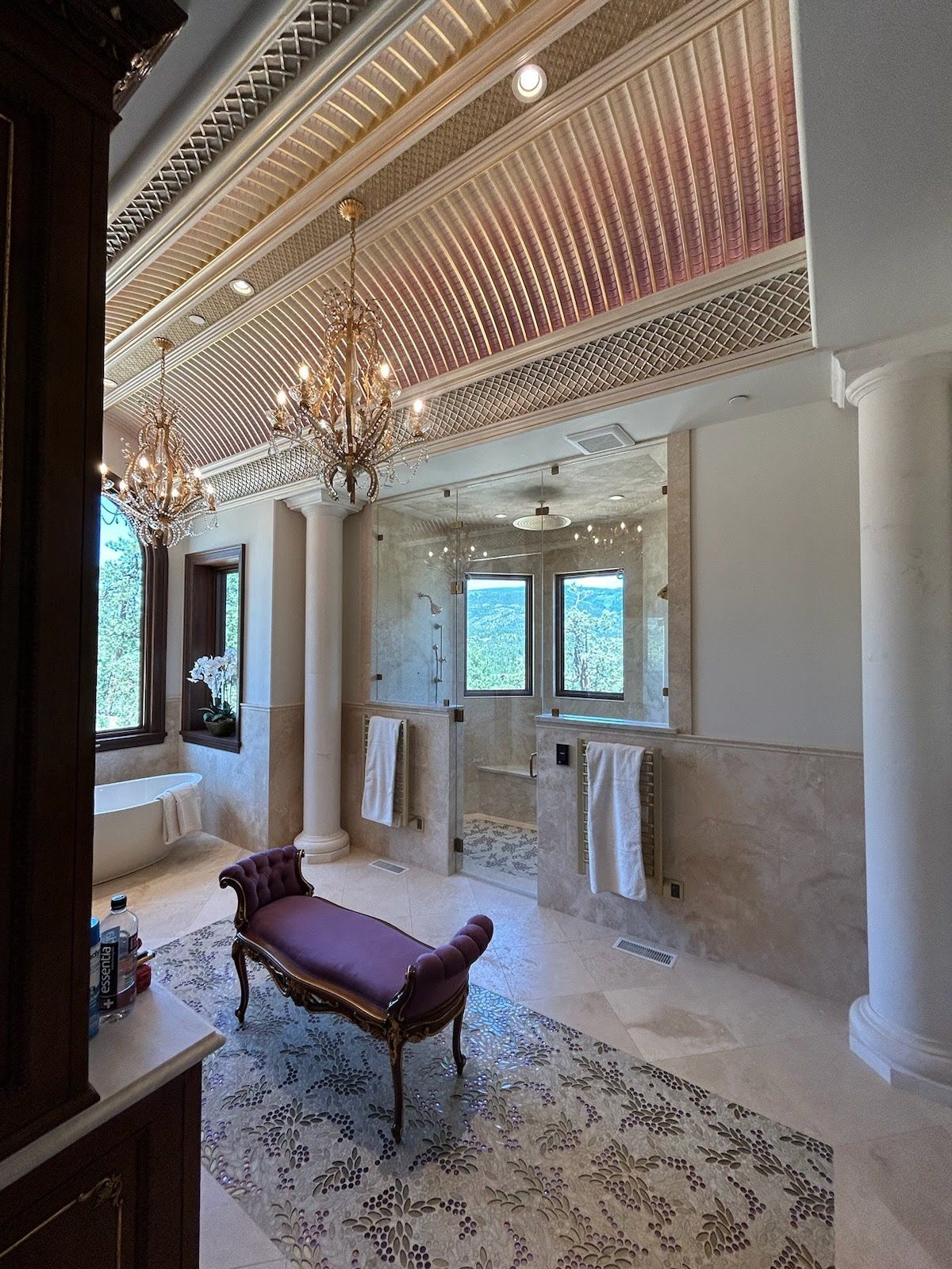 A bathroom with a bench in the middle of it