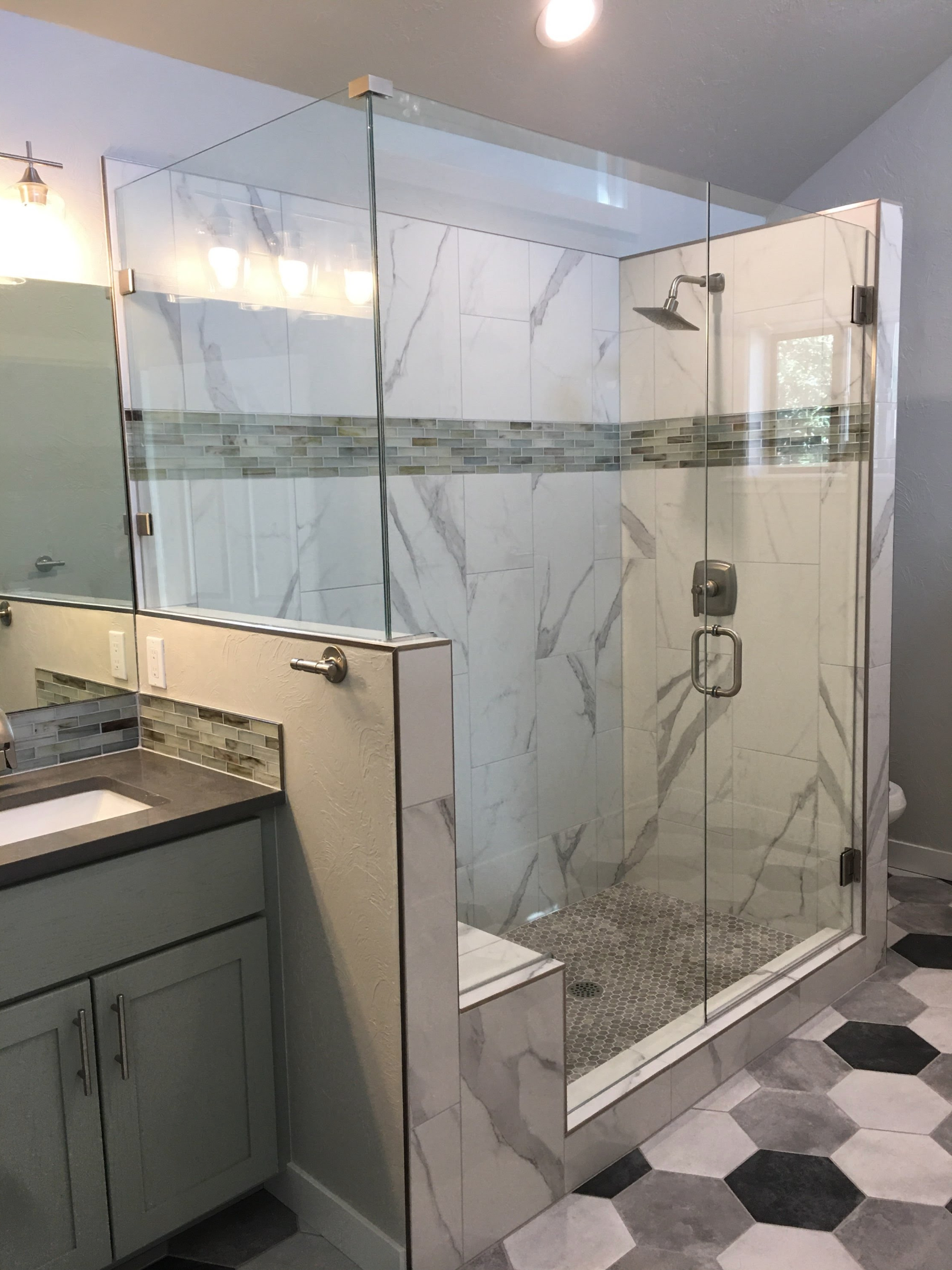 a shower with custom shower glass made by Sun Glass