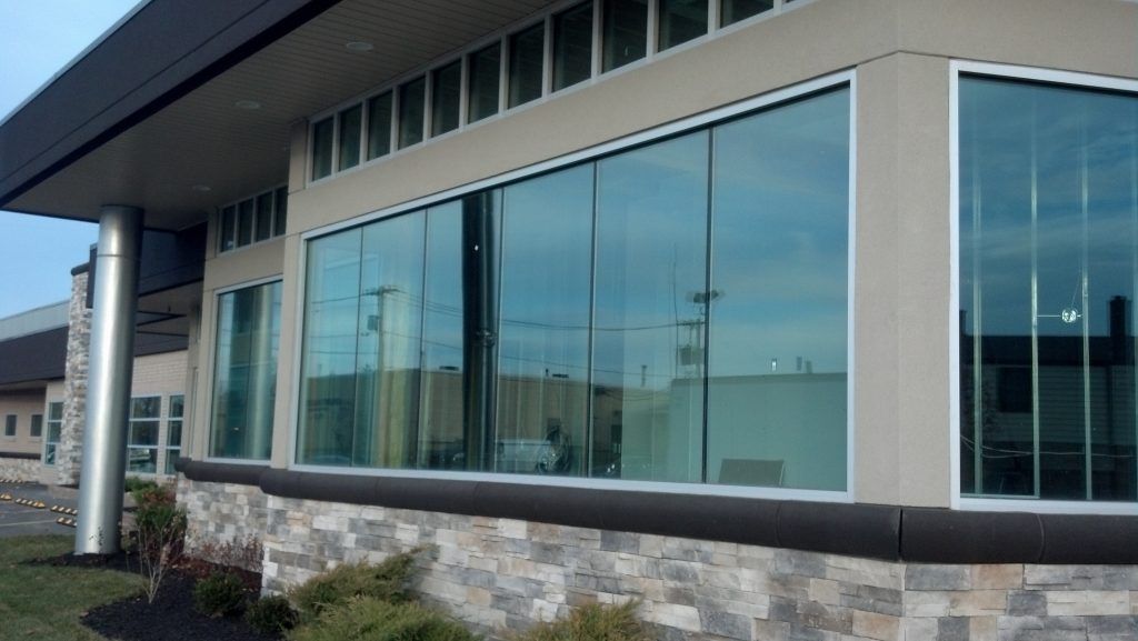 a building with a lot of windows installed by Sun Glass