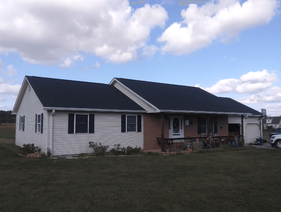 A large white house with a black roof