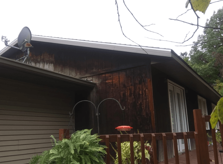 A house with a satellite dish on the roof