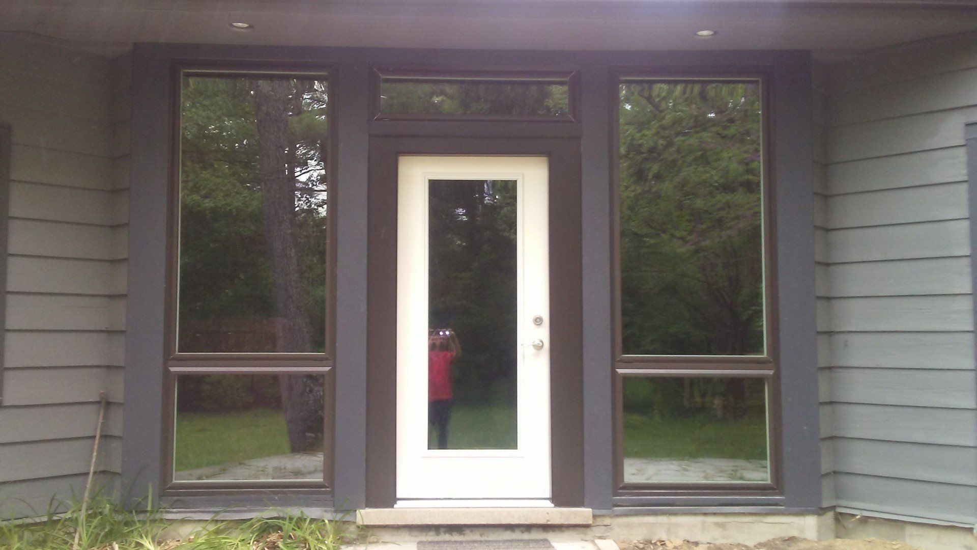 A house with a white door and a lot of windows