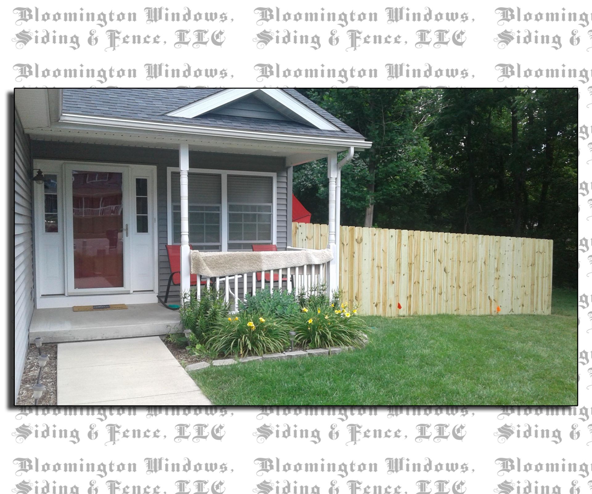 A picture of a house with a wooden fence by bloomington windows
