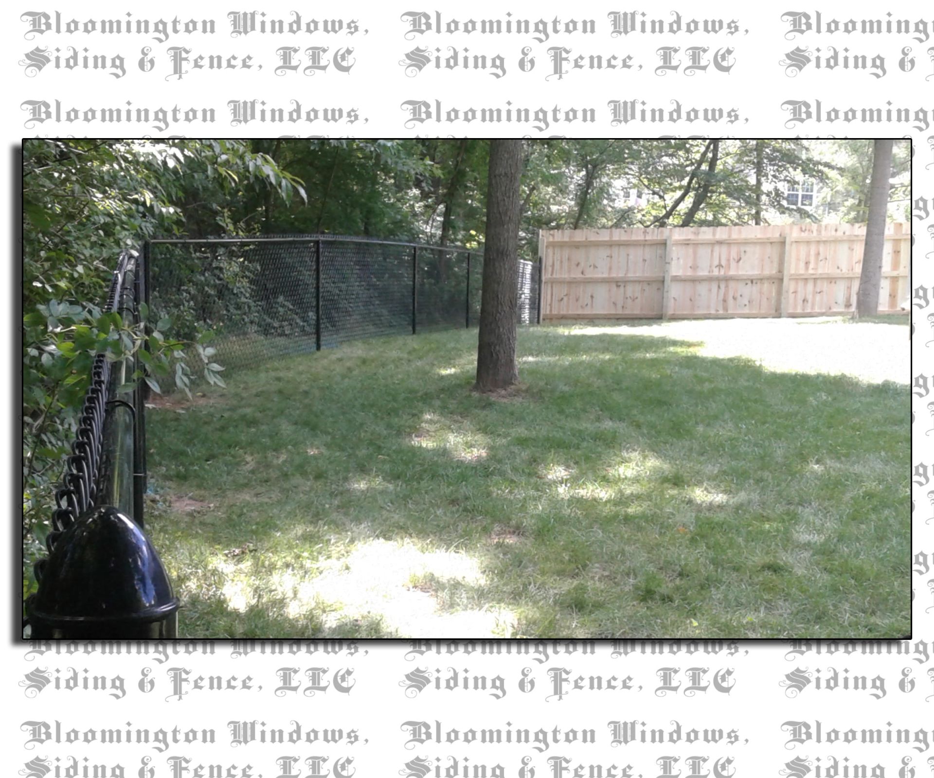 A picture of a backyard with a chain link fence by bloomington windows