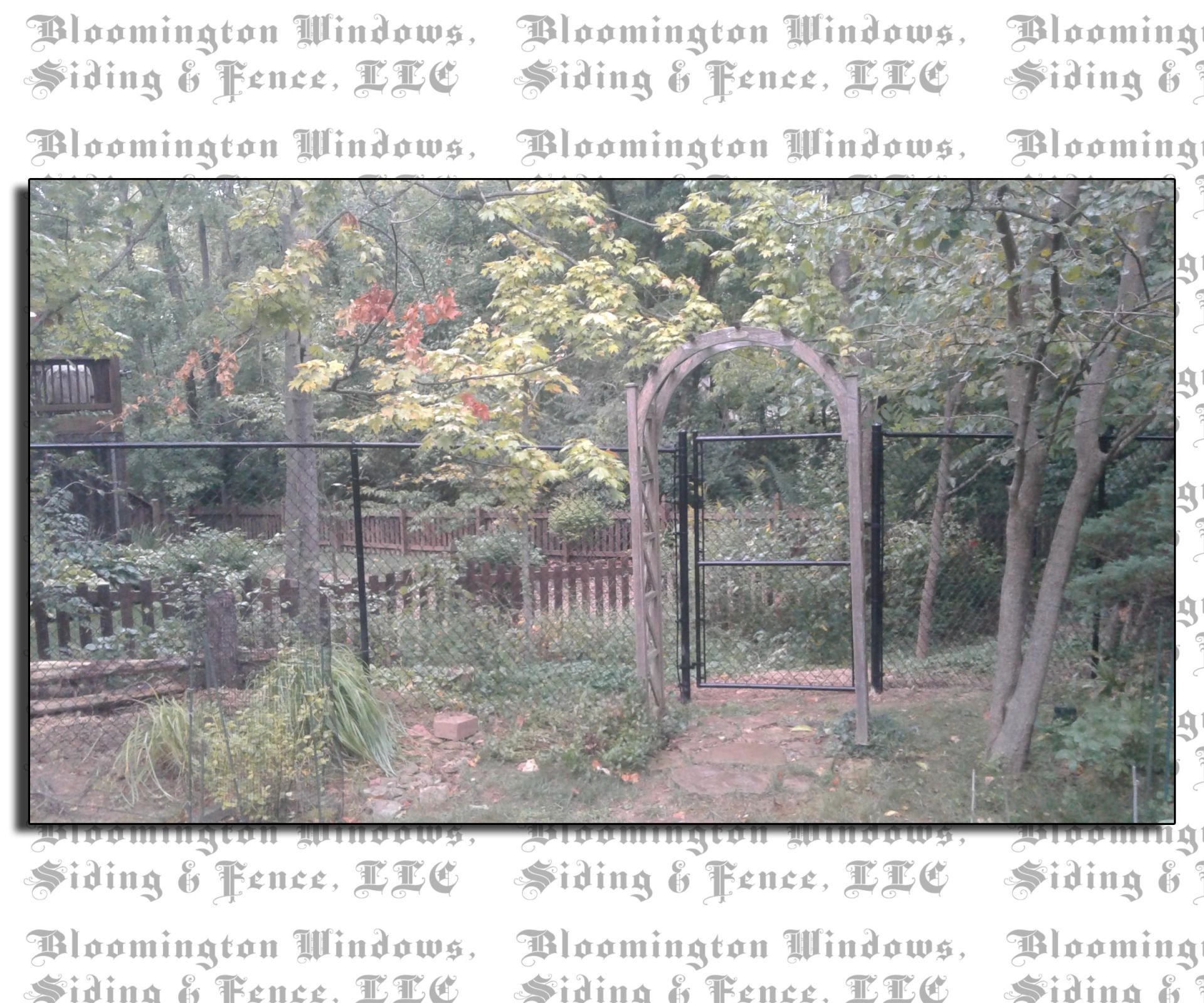 A picture of a garden with the words bloomington windows siding & fence llc