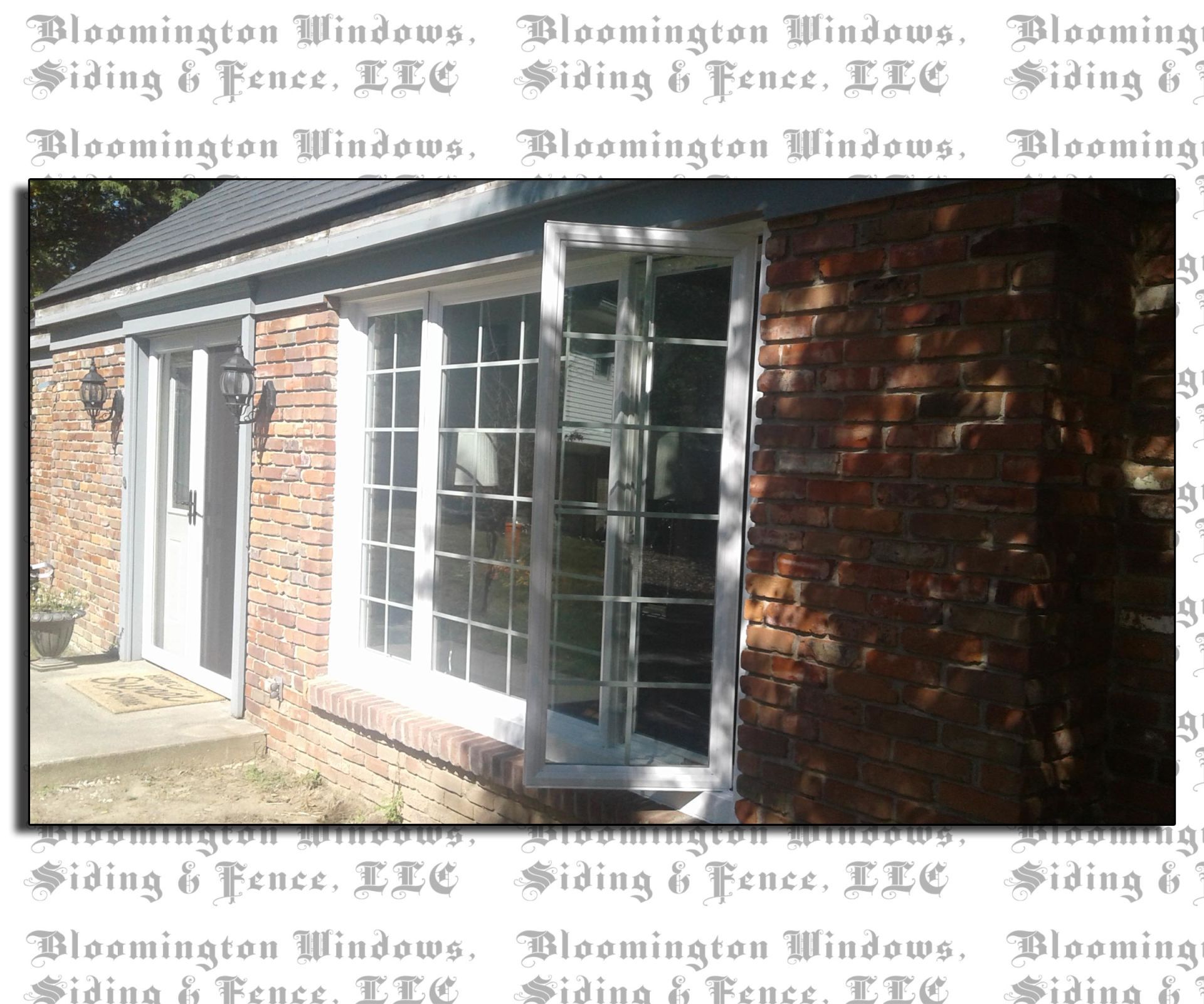 A picture of a brick building with a white window