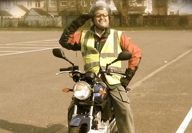 a motorcyclist smiling