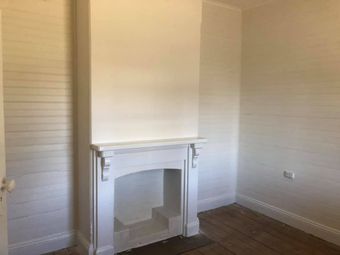 Freshly painted wall and fireplace after renovation - Painting Services in Dubbo, NSW