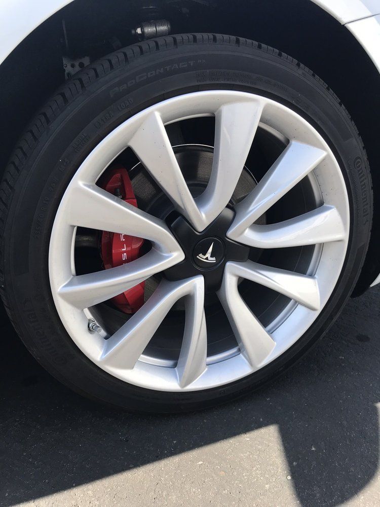 A close up of a tesla model 3 wheel
