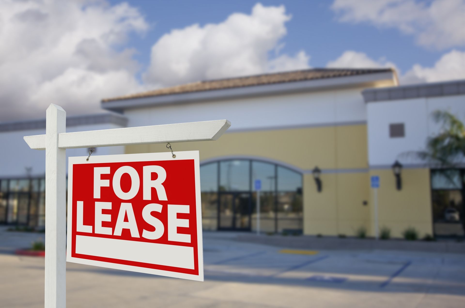 A for lease sign in front of a building