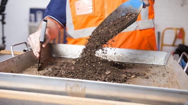 Soil testing by a civil engineer.