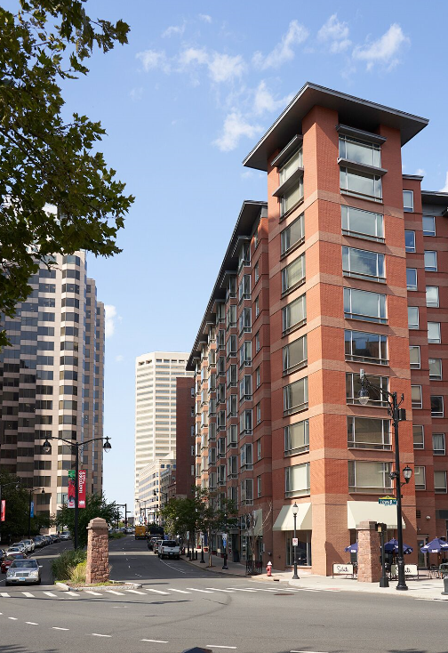 A tall brick building with a lot of windows