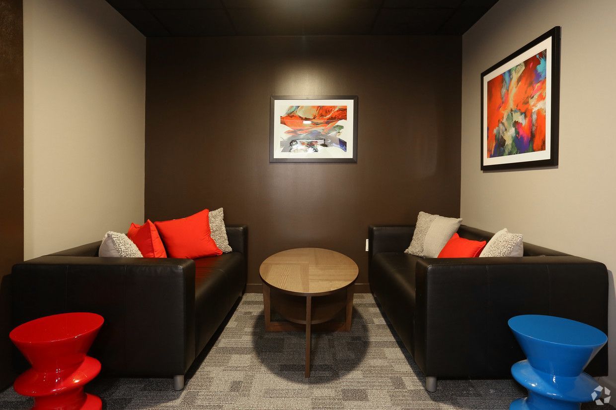 A living room with two couches and a table