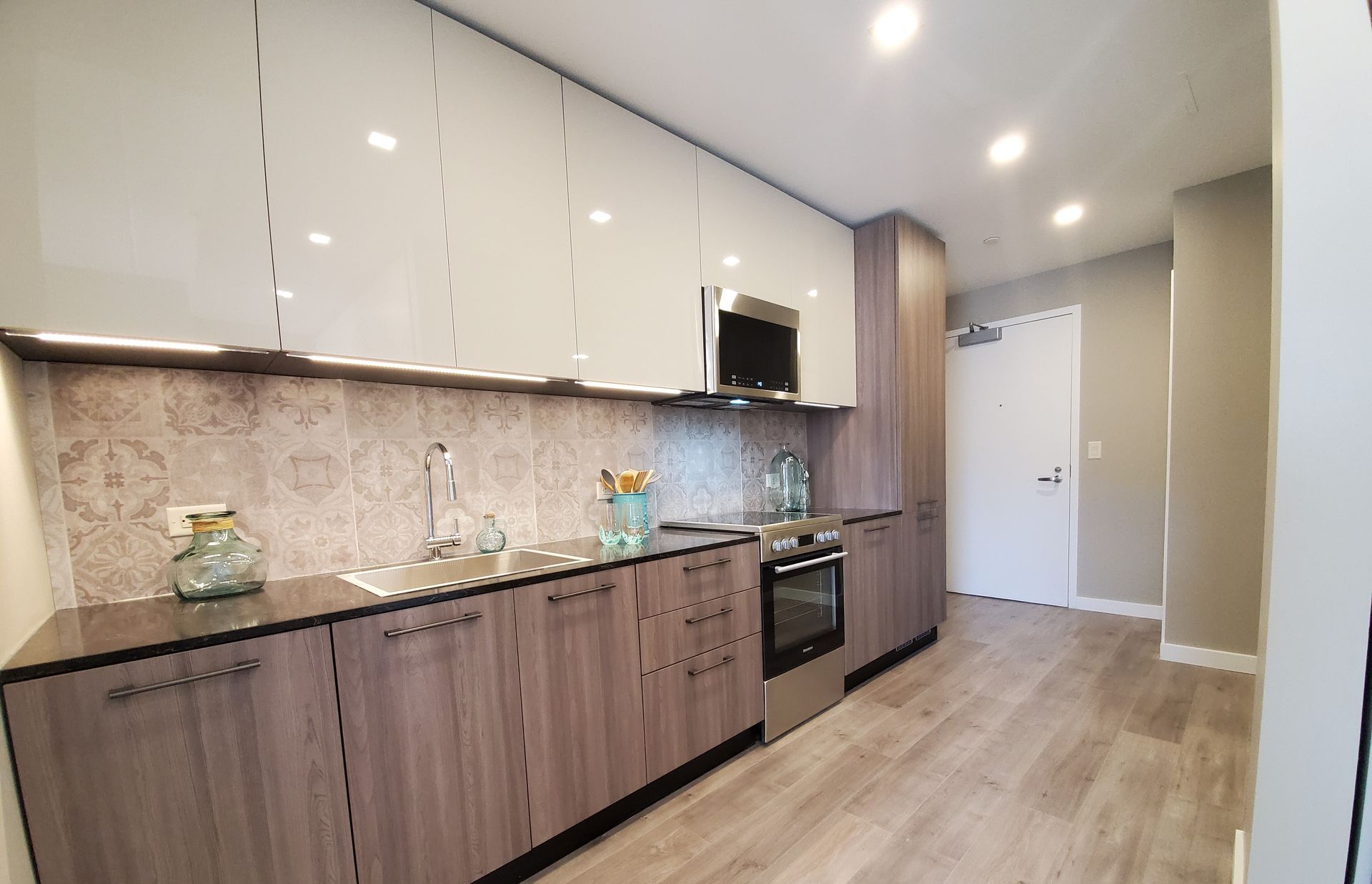 A kitchen with wooden cabinets and stainless steel appliances.