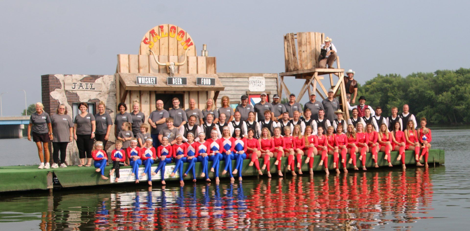 A group of people are standing on a dock