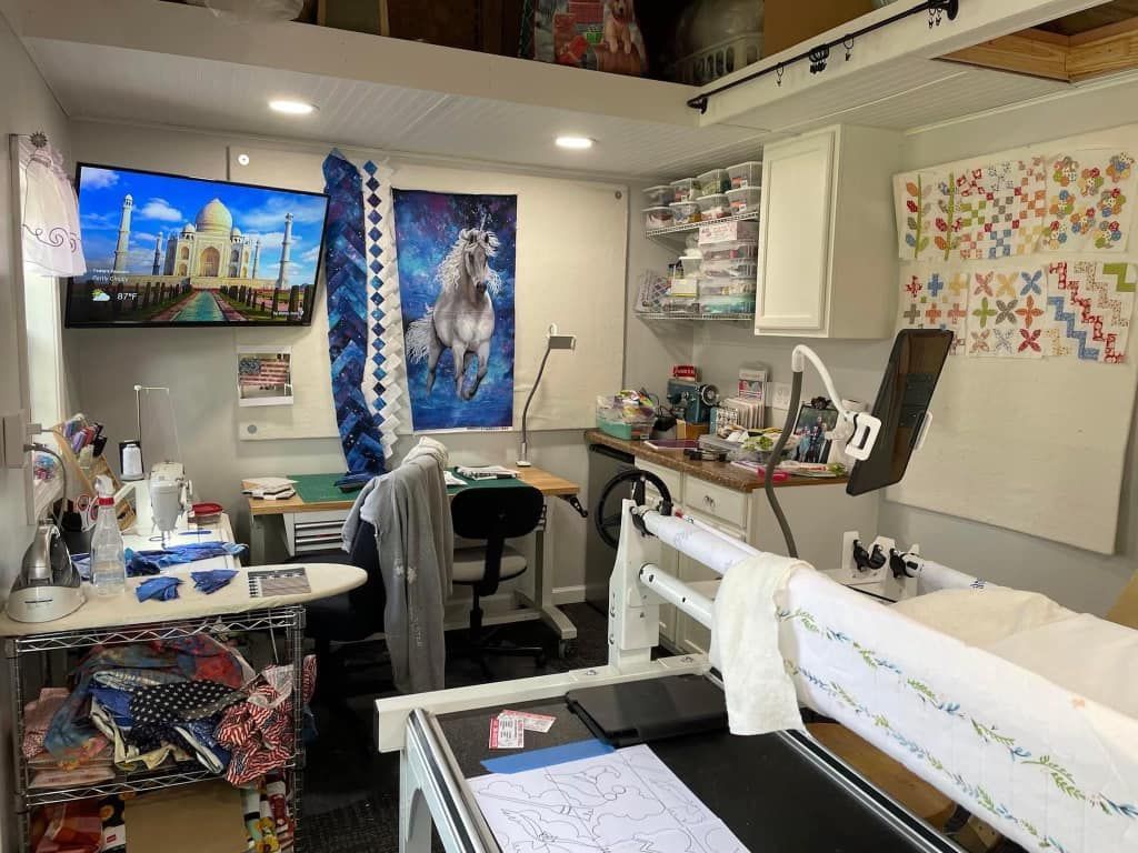 There is a sewing machine in the middle of the room.