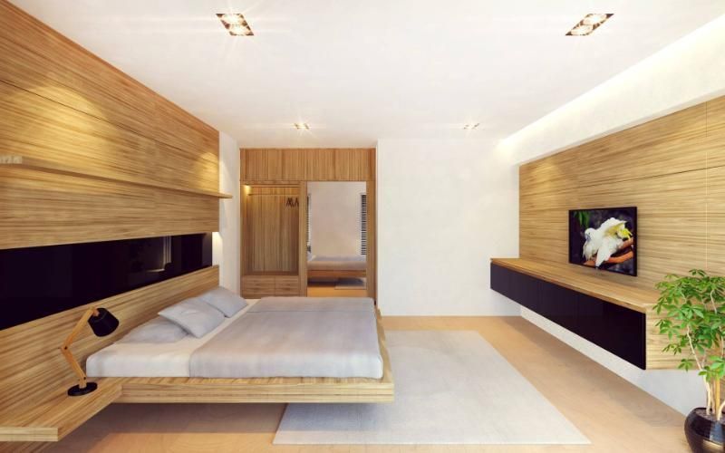 Una camera da letto con un letto grande e una tv a schermo piatto