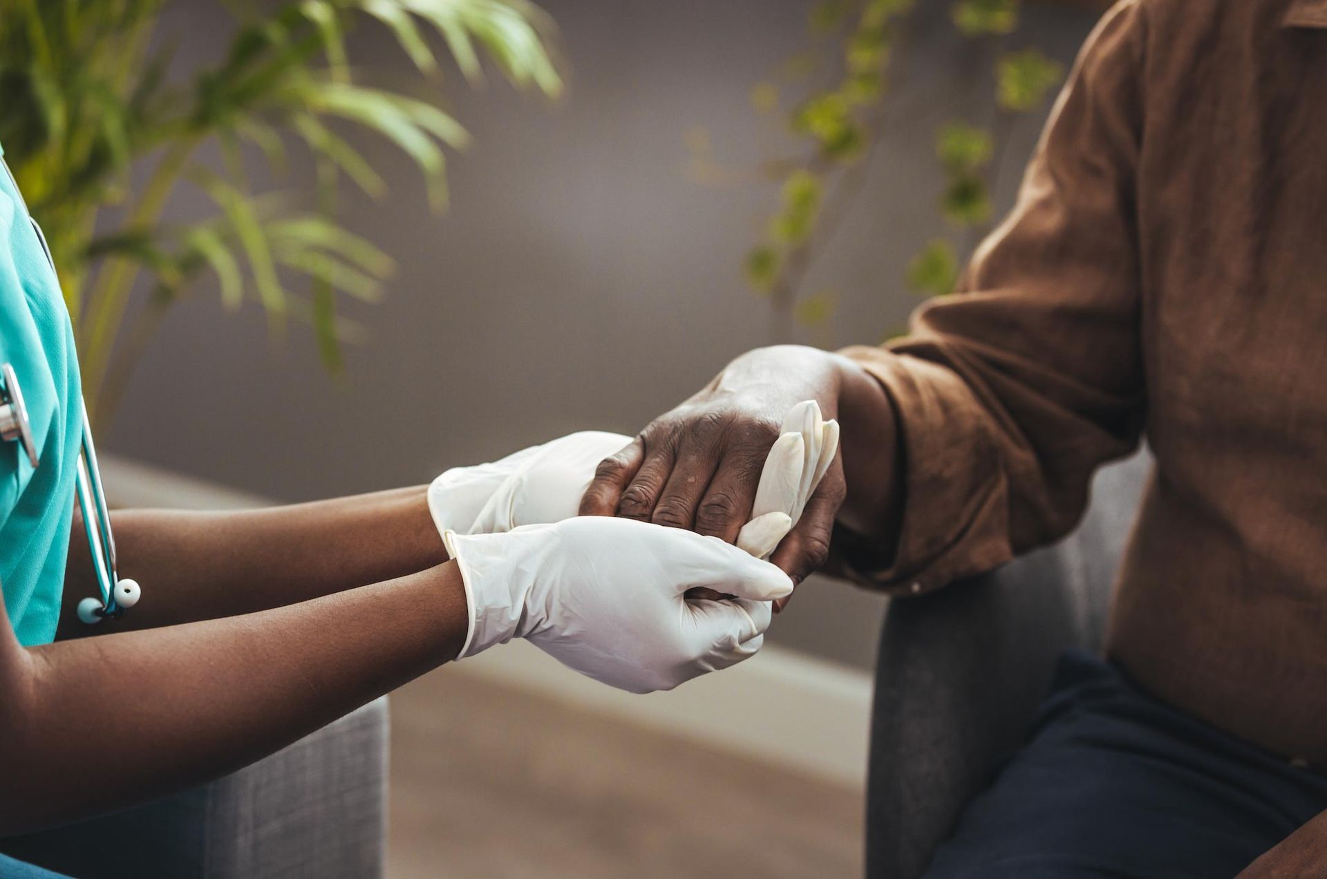 Nurse is Holding the Hand of an Elderly Woman — Universal Nurse in Blackbutt North, QLD