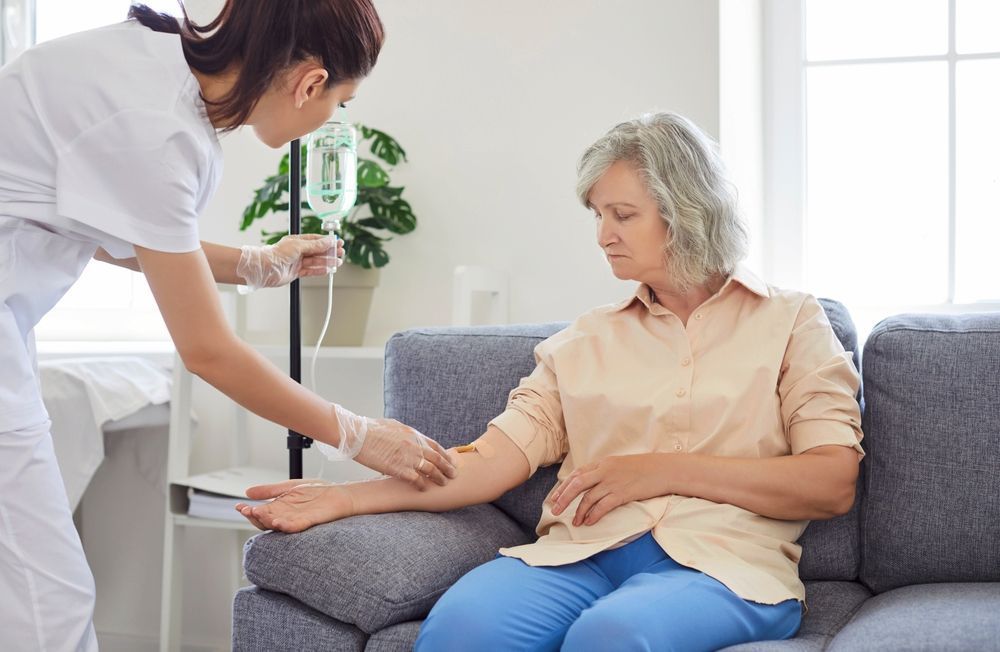 Nurse Preparing an IV for an Elderly Woman — Universal Nurse in Yarraman, QLD