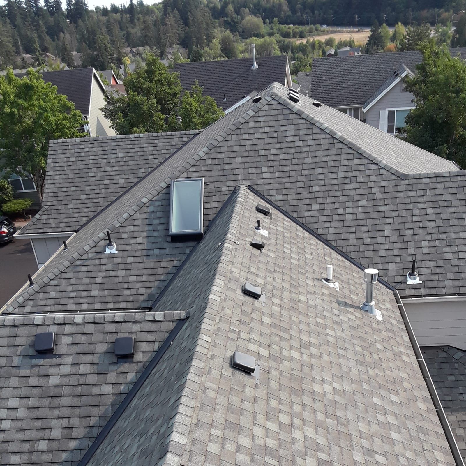 an aerial view of a roof with a skylight