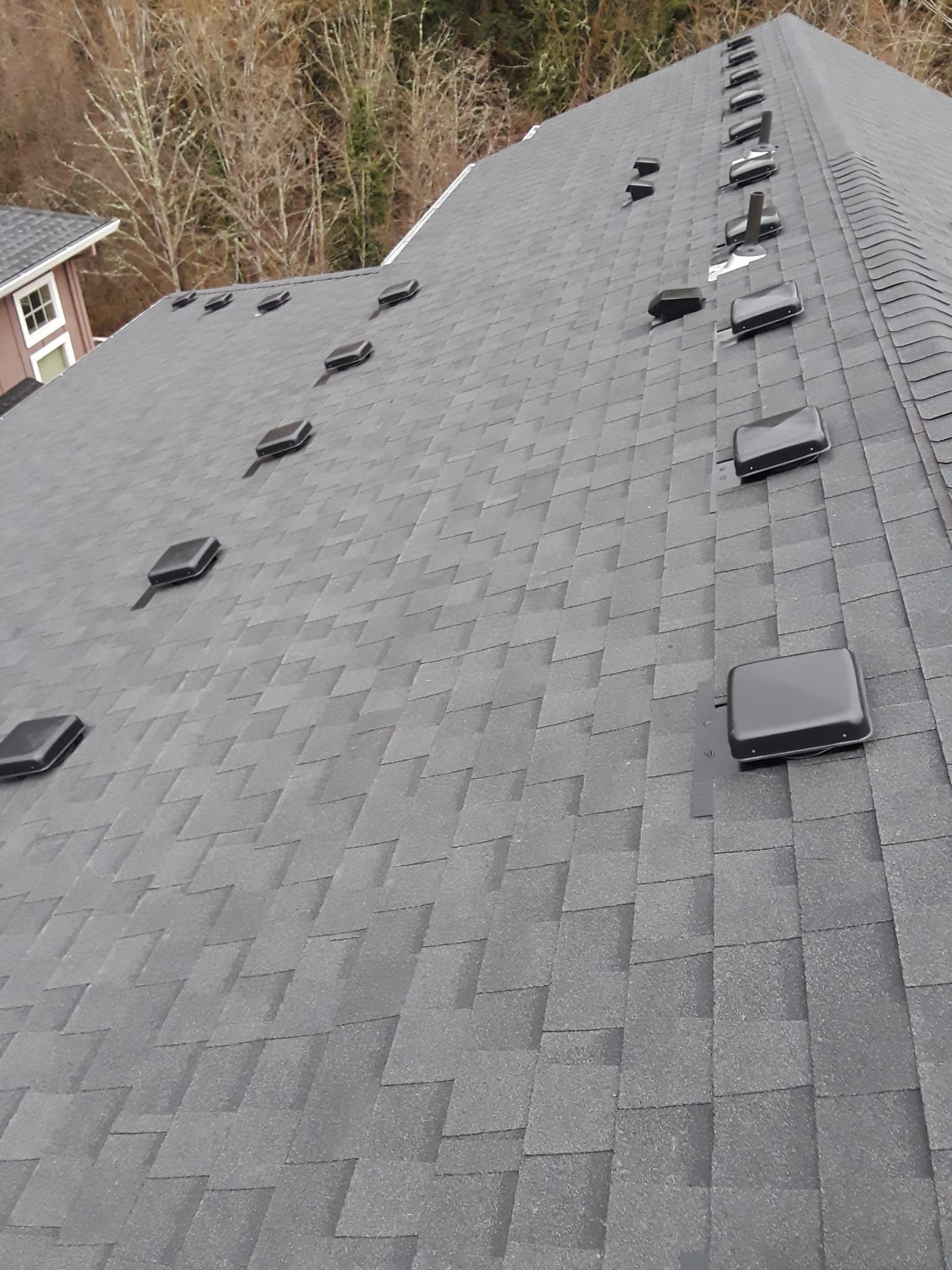 the roof of a house with a lot of vents on it .