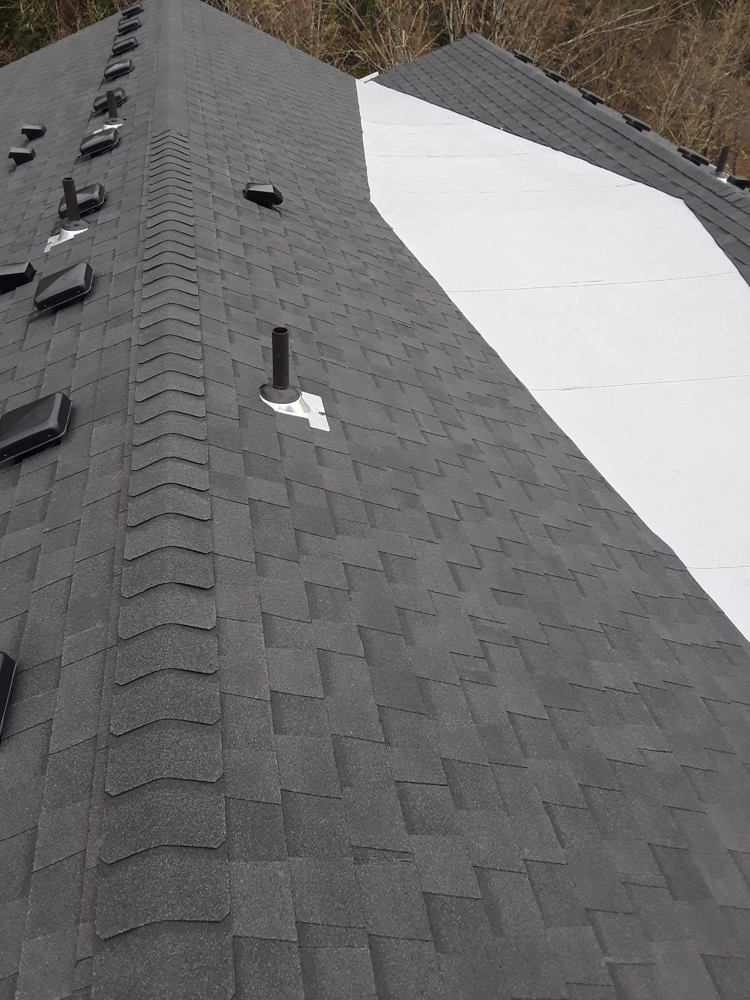 a close up of a roof with a white triangle on it .