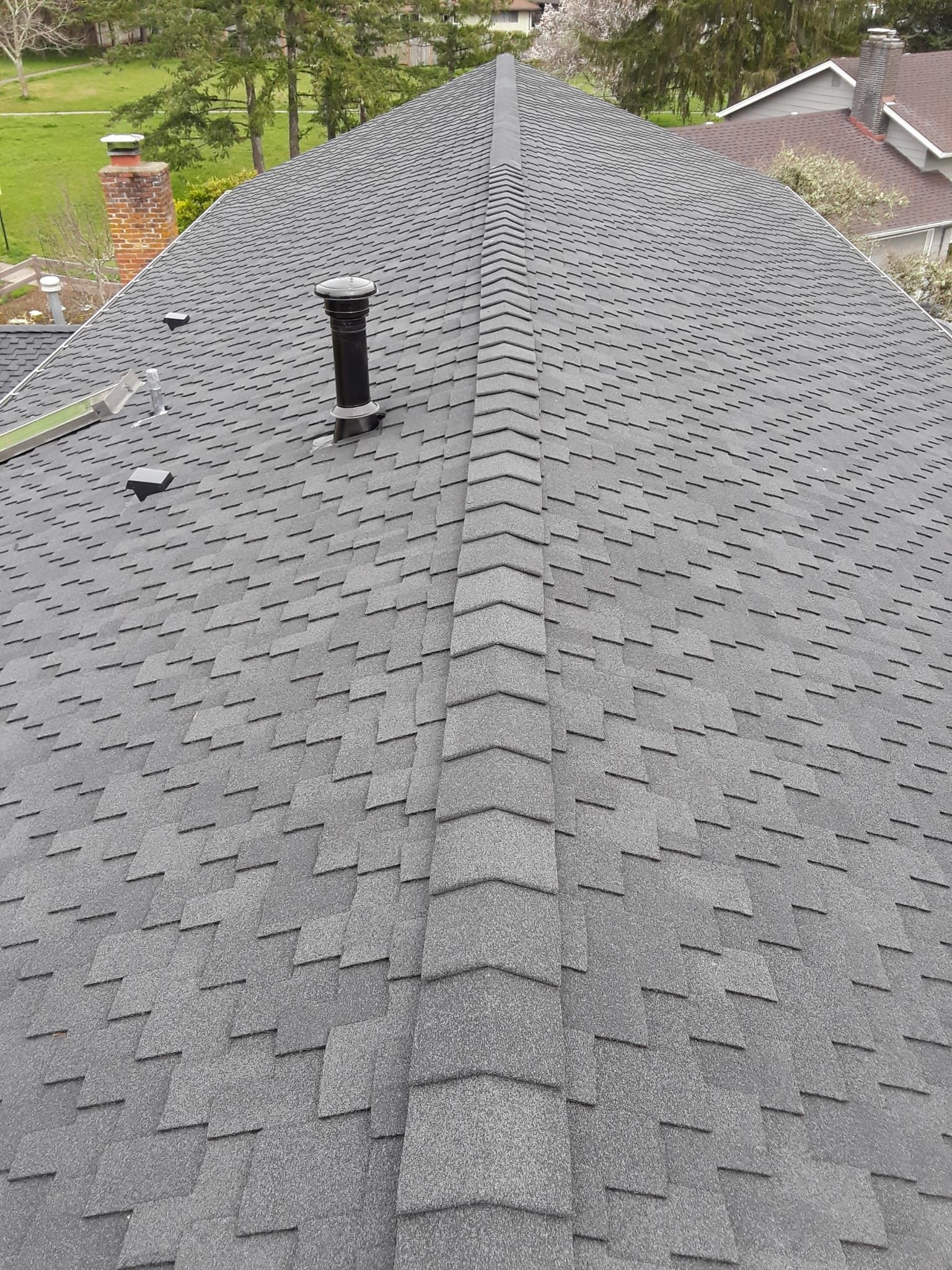 a close up of a roof with a chimney on it