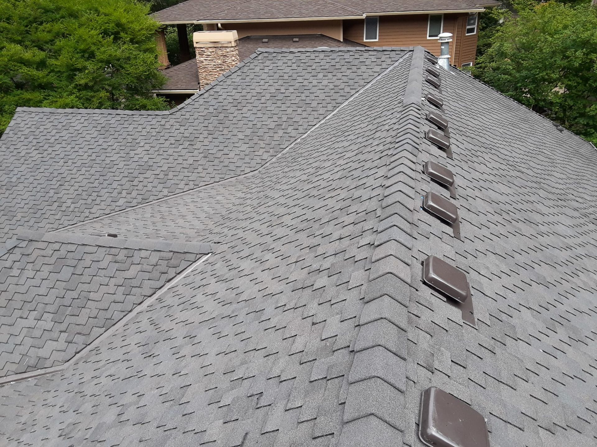 the roof of a house has a lot of vents on it
