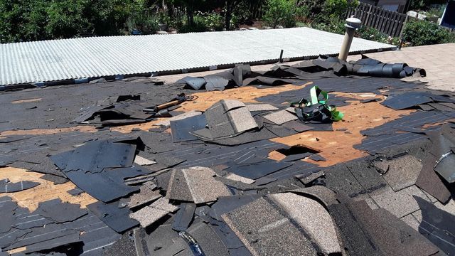 a roof with a lot of shingles laying on it
