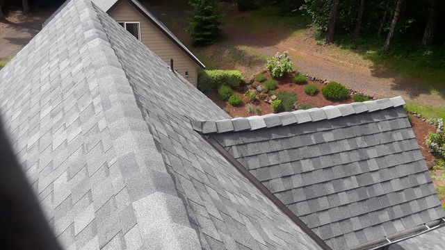 an aerial view of a roof of a house with a lot of shingles .