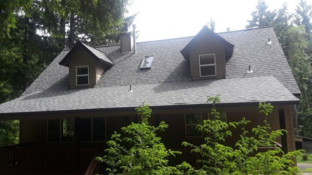 a house with a roof that has a skylight on it