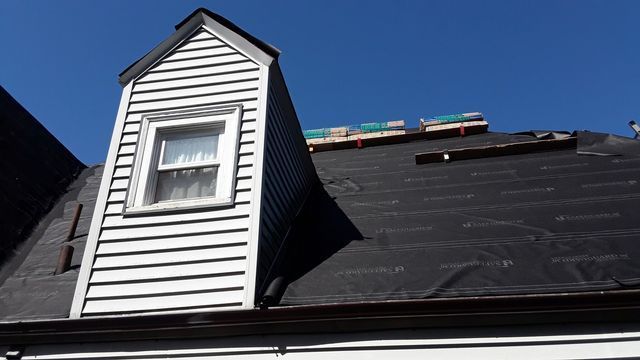 a house with a small window on top of it