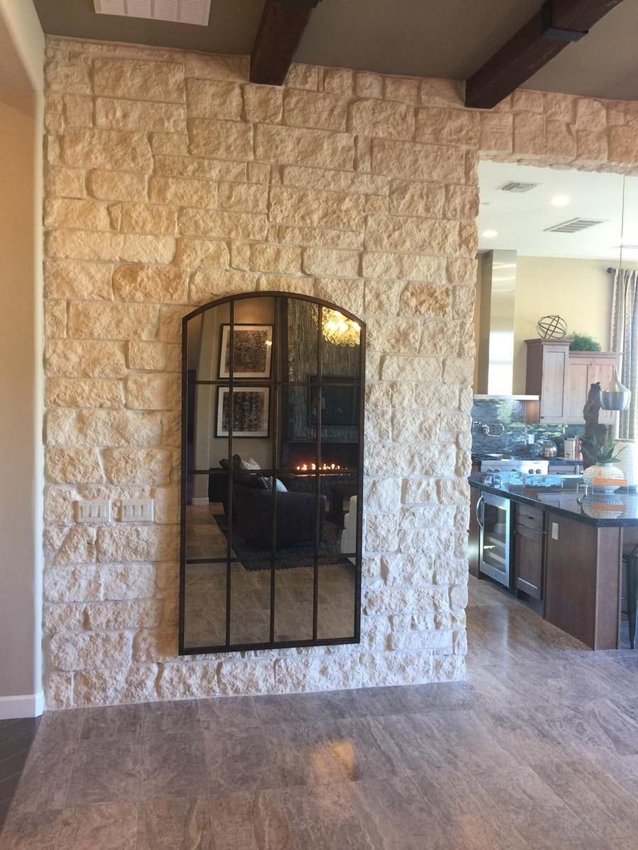 Natural stone mirror on wall