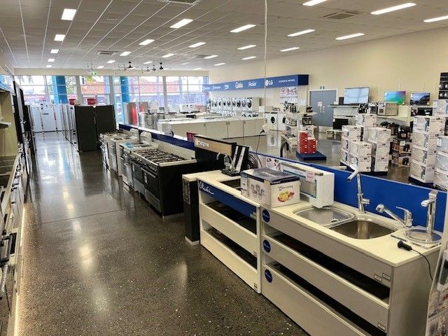 A Woman is  Advertising a Washing Machine — The Latest Home Appliances in Rockhampton